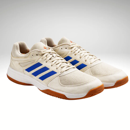 A pair of Adidas court sneakers in off-white with three blue stripes and a gum brown outsole, shown on a light gray background.